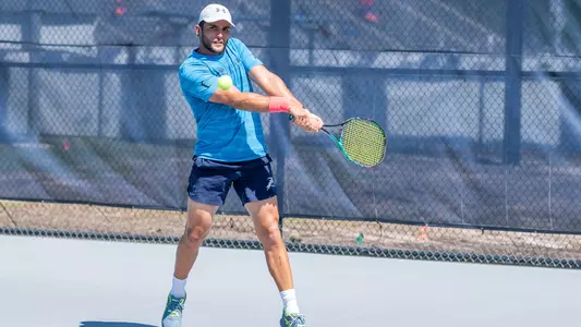 Rodrigo Crespo backhand in blue shirt