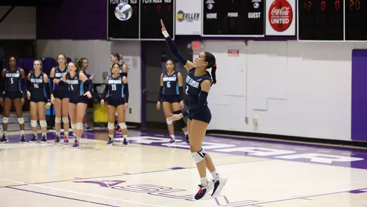 Kailey McKnight going up for a serve at the service line