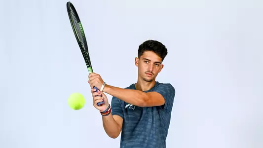 Spencer Dorosheff hitting a backhand