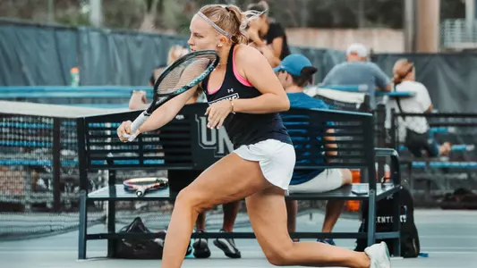 Jasmin Makela going for a backhand in the Fall Invite