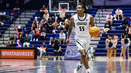Ametri Moss dribbling the ball up the court