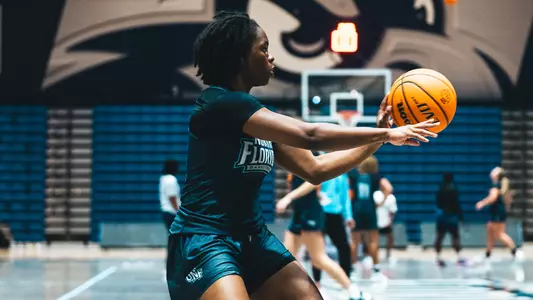 Kaila Rougier at practice passing ball