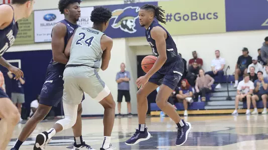 Chaz Lanier dribbling at the top of the three-point line