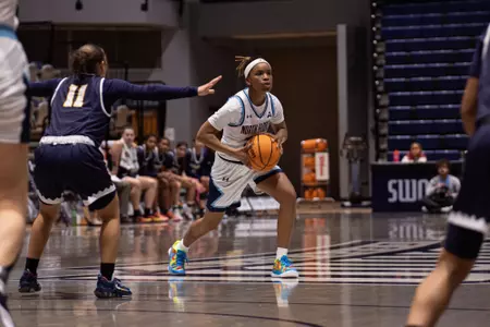 Jayla Adams passing the ball at half court
