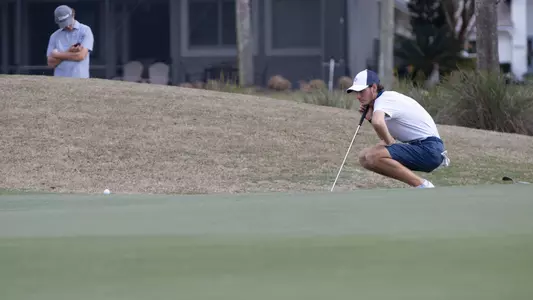 Nick Gabrelcik evaluating putting green