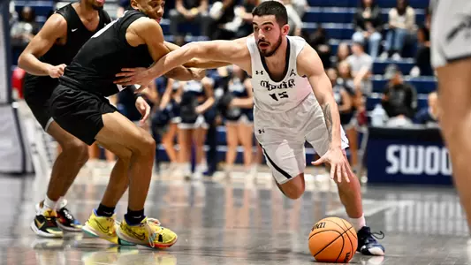 Jose Placer dribbling to the hoop