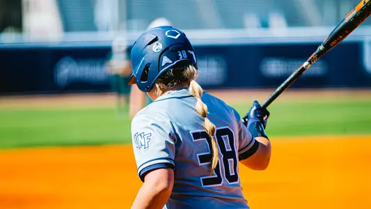Logan at bat home softball