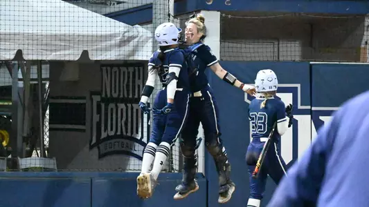 Savannah Channell and Mackenzie Woods chest bump