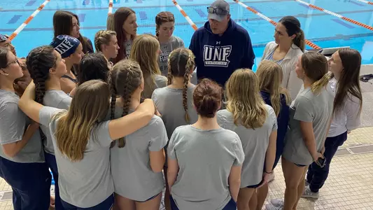 Head Coach Ian Coffey debriefs with the team after the CCSA Championships