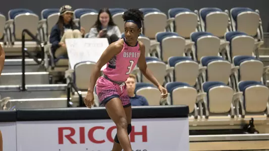 Brianna Livingston defending in breast cancer awareness game