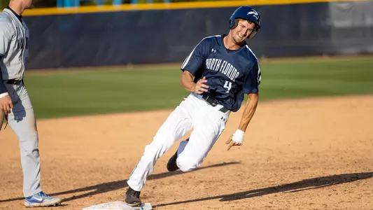 Cade Reich rounding third base