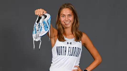 Isa Leen holding shoes up