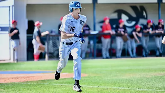 Blake Pound running to first base