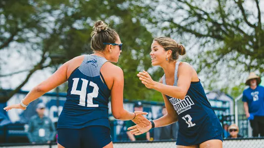 Mariana Feliciano-Sanchez and Mackenzie Murphy high fiving