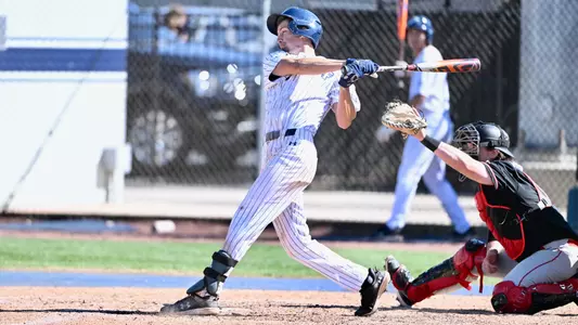 Cade Reich swinging at a pitch