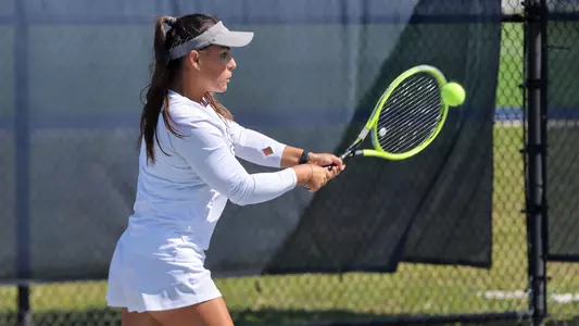 Ana Paula Melilo hitting a backhand against Austin Peay