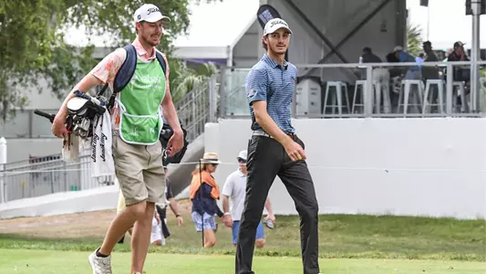 Nick Gabrelcik walking with brother as caddie at Valspar Championship