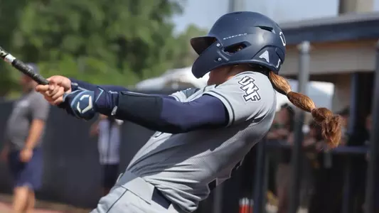 Shannon Glover hits ball at the plate