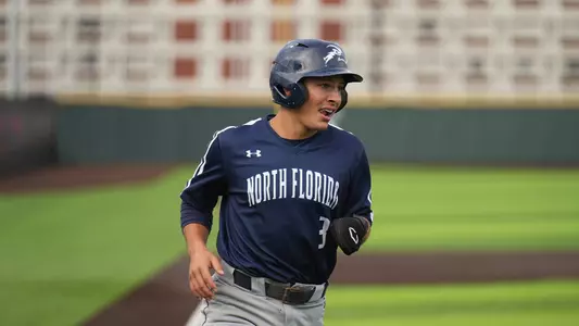Aidan Sweatt crossing home plate at EKU