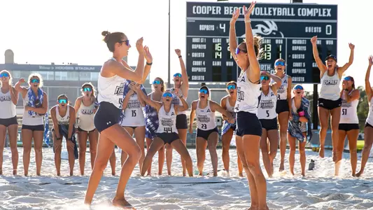 Madison Espy and Presley Murray against Pepperdine, celebrating their win
