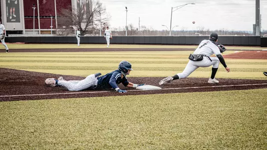 Alex Lodise sliding into third base in game at EKU