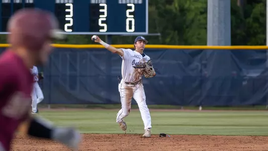 Alex Lodise throwing over to first base against FSU
