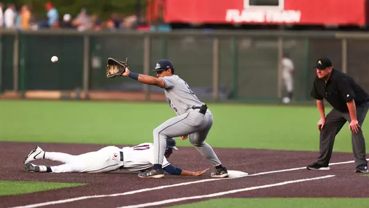 Gabriel Esquivel catching a throw over to first base at Liberty