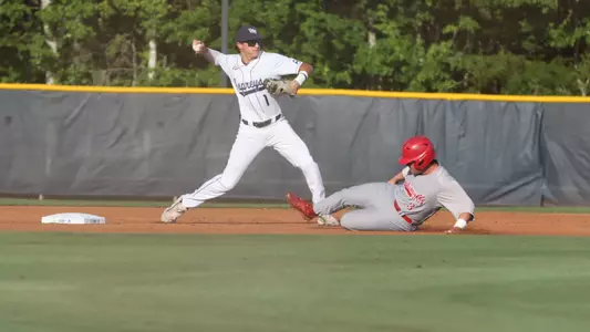 Alex Lodise throwing the ball from second base trying to turn two