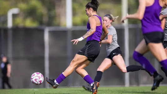 Thais Reiss kicking the ball during practice