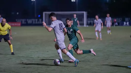 Angus Taylor dribbling through JU defense