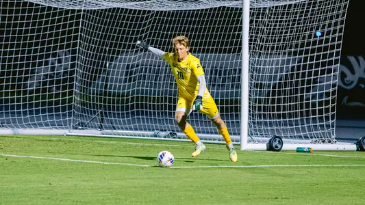 Micah Gun kicking ball to midfield