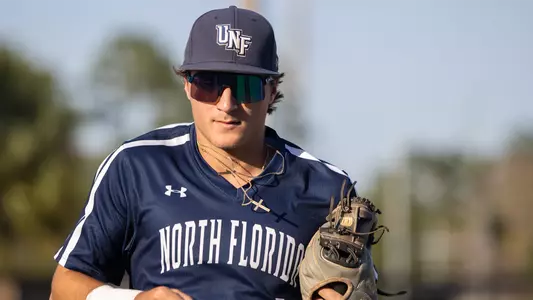 Alex Lodise running back into the dugout