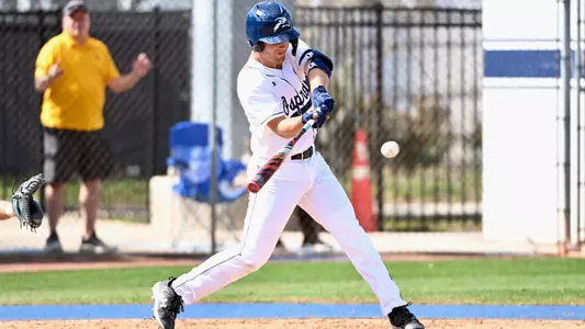 Finn Howell swinging at a pitch