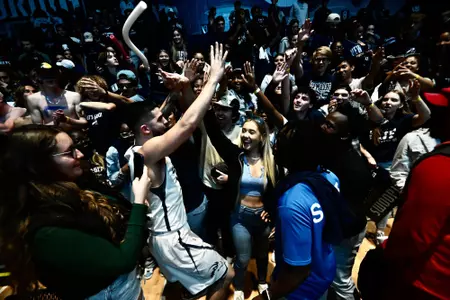 Photo of Jose Placer going through the student section