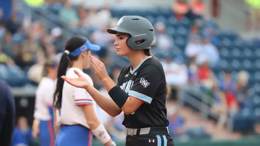 Chloe Culp clapping at dugout