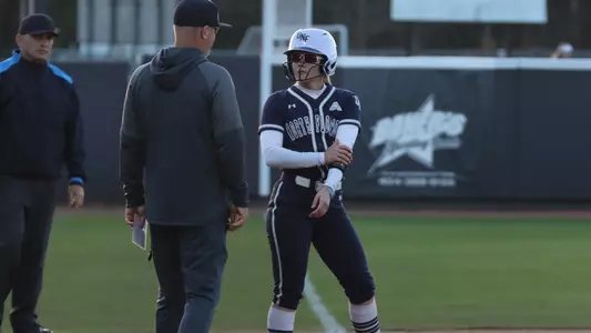 Grace Hogie talking to coach on third