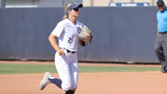 Kelsey Vogel running back to dugout