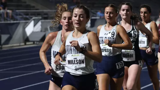 Emma Millson in group at home track & field