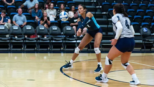 Kailey McKnight digging an attack vs. New Mexico State