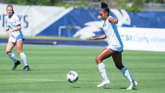 Allyna Thurston kicking the ball up the field