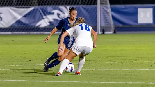 Paige McSwigan dribbling up the field