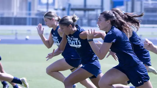Women's soccer doing sprints