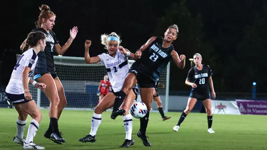 Chloe Lynch jumping up for a ball during a game