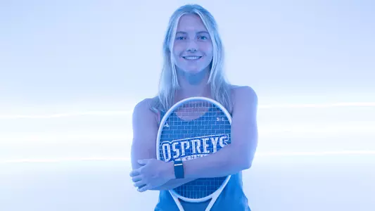 Annabelle Davis hugging her racquet