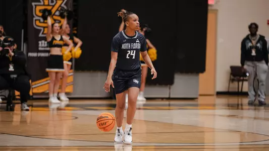 Jayla Adams dribbling up court against Kennesaw State