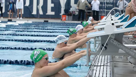 Swimming getting ready to go off the blocks against FGCU