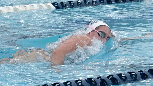 Paige Munna swimming at the UNF Competition Pool Complex