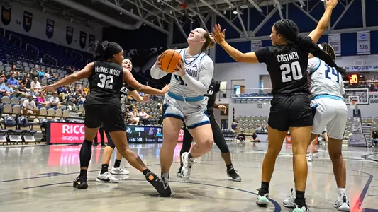 Emma Broermann layup contested against EKU