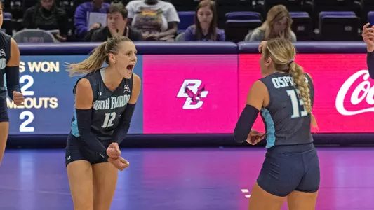 Amy and Annie celebrate a point