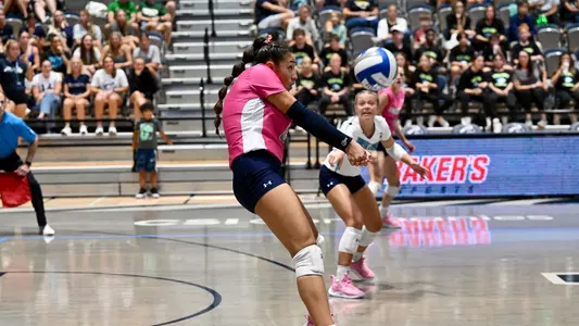 Janelly Ceopa dig in pink jerseys